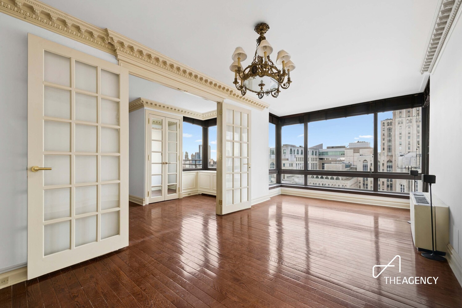 524 East 72nd Street, Unit 22D Manhattan, NY 10021 - Photo 1 of 12 a view of a livingroom with wooden floor and a large window