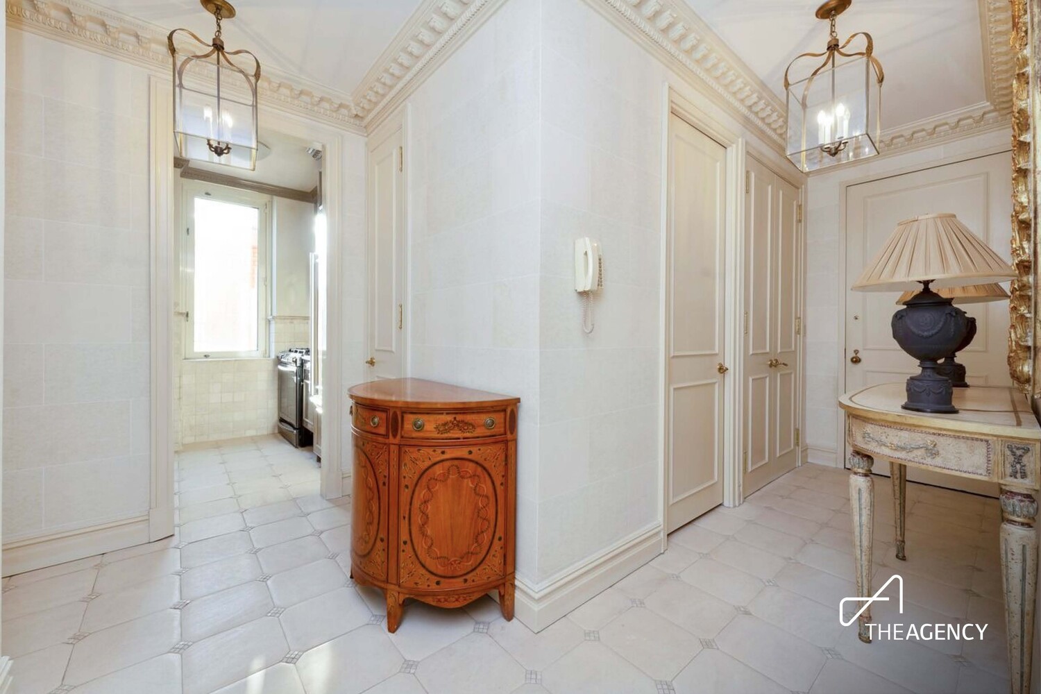 524 East 72nd Street, Unit 22D Manhattan, NY 10021 - Photo 11 of 12 a view of a hallway with washer and dryer
