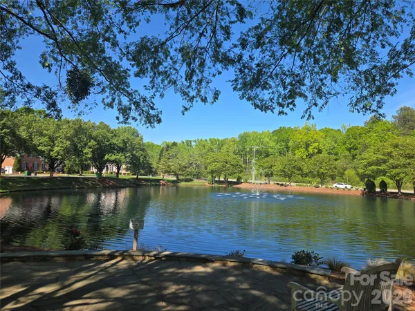 a view of a lake next to a building with a lake