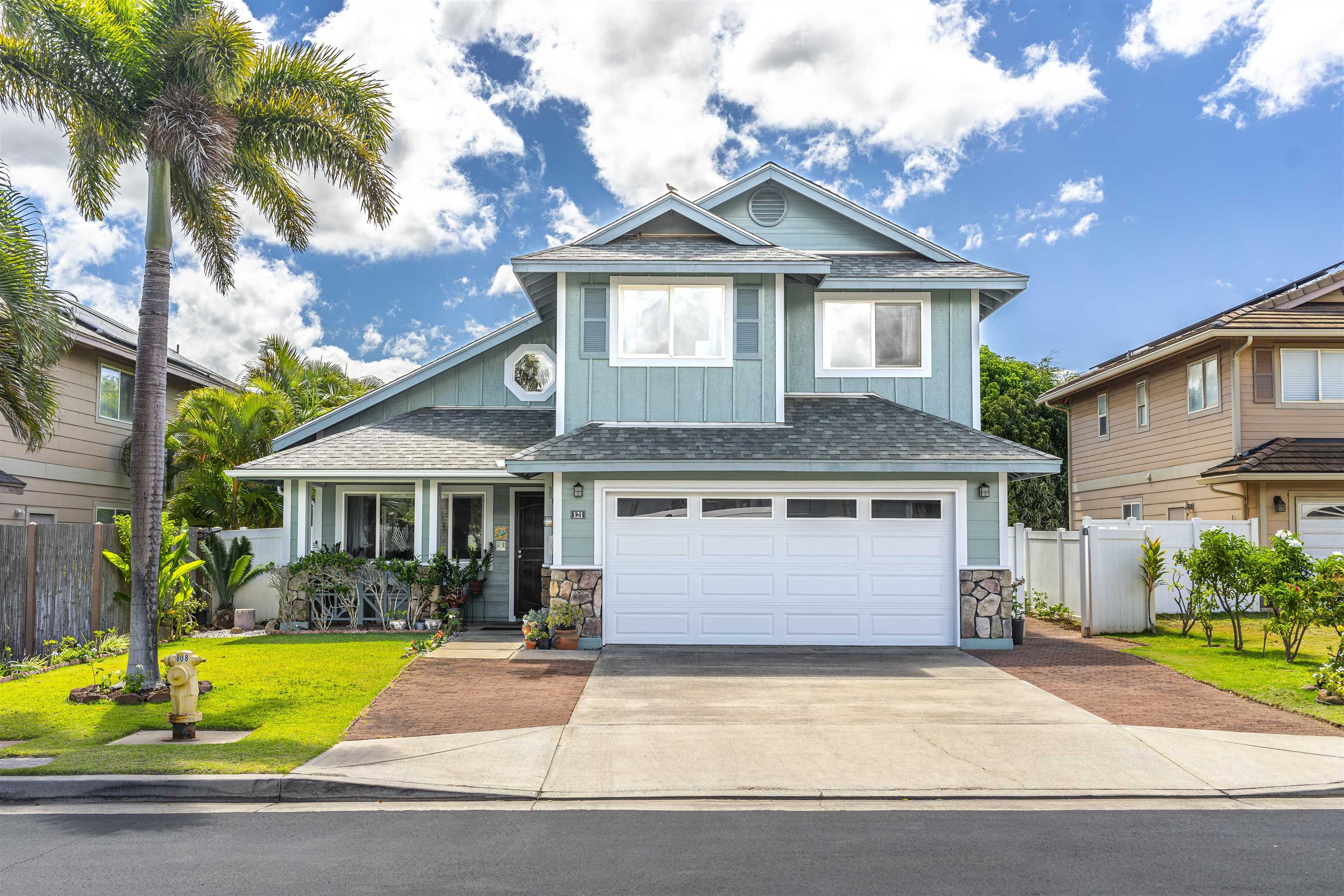 121 Molehulehu Loop Kahului, HI 96732 - Photo 2 of 43 a front view of a house with a garden and plants