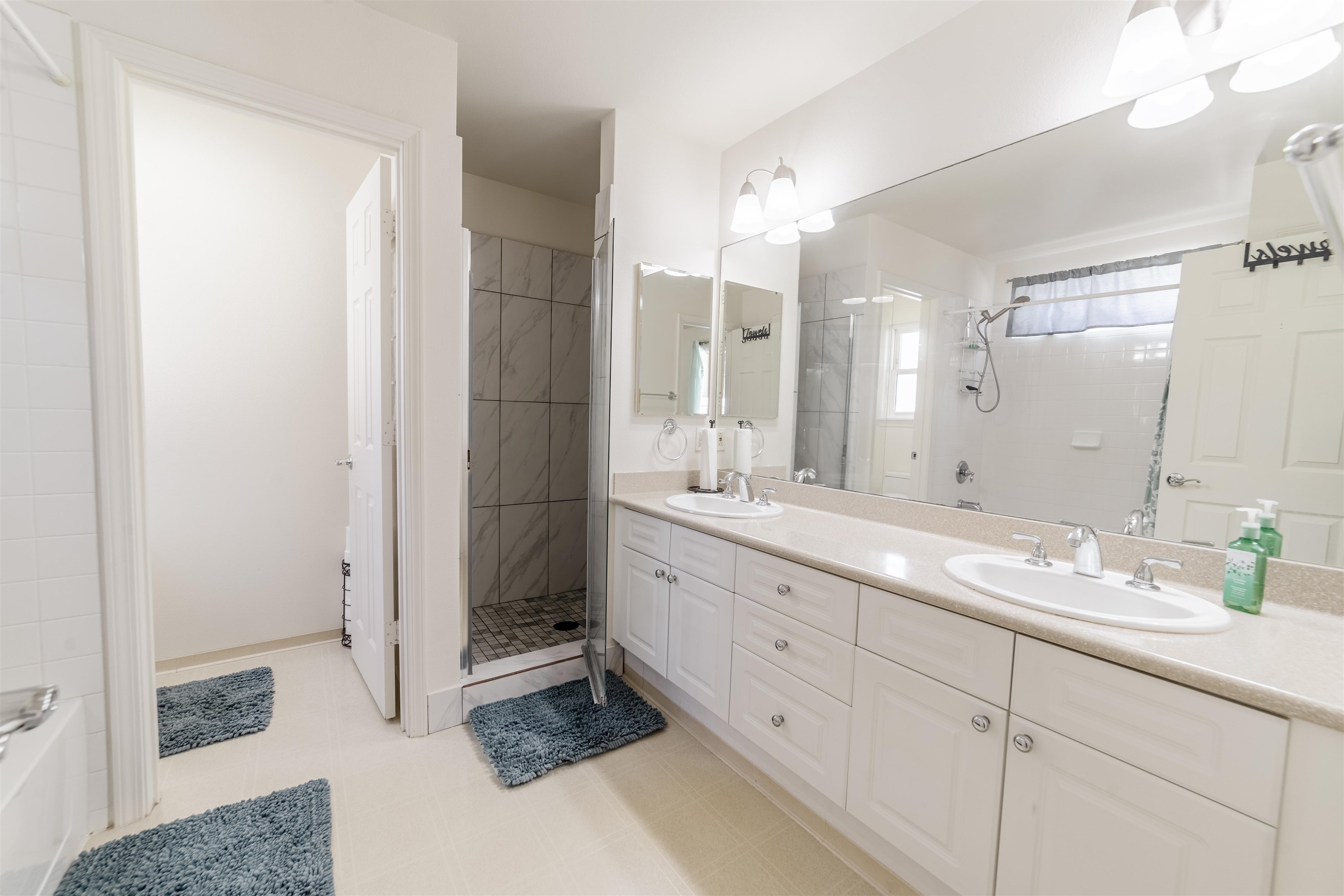 121 Molehulehu Loop Kahului, HI 96732 - Photo 22 of 43 a spacious bathroom with a double vanity sink a mirror and a shower