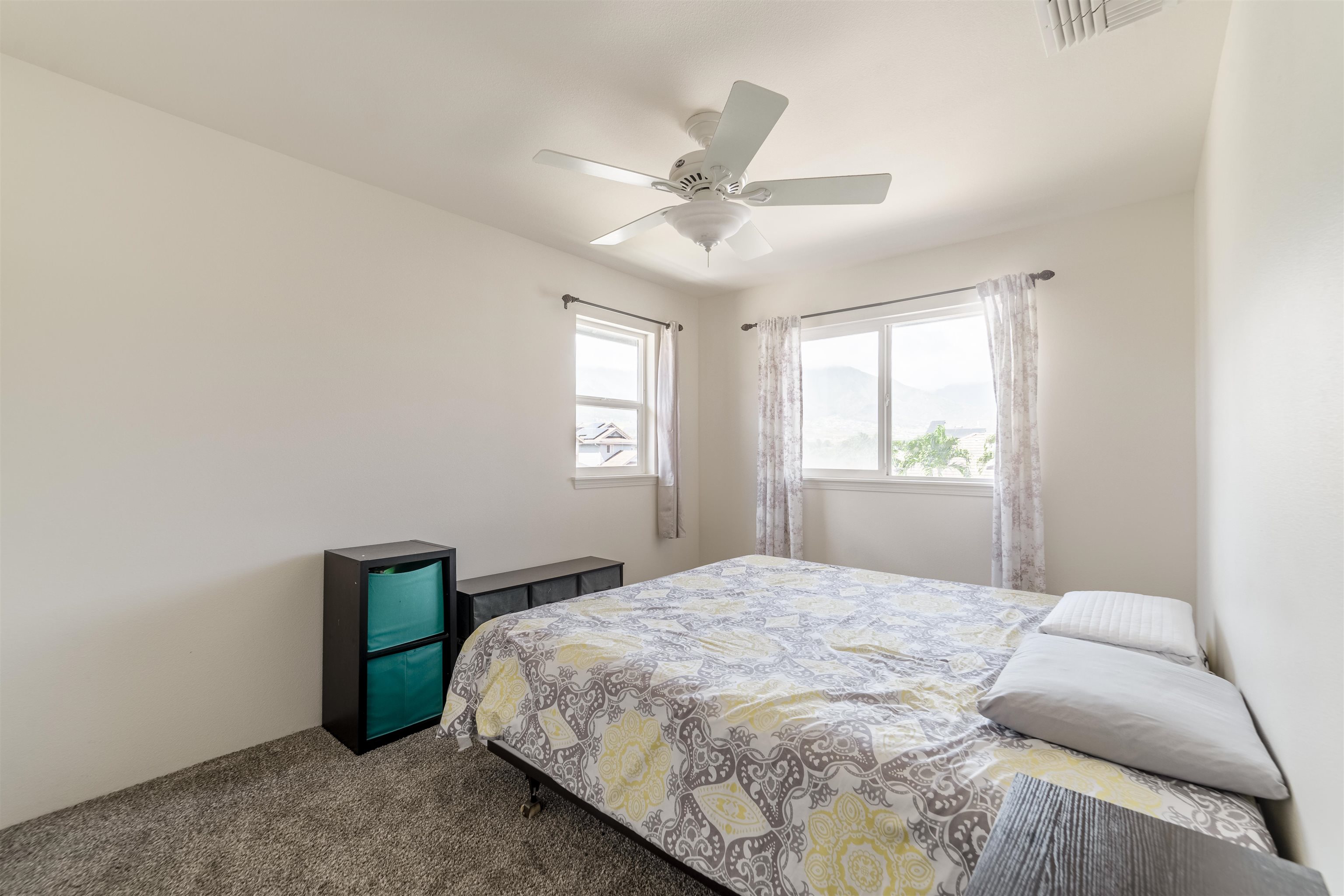 121 Molehulehu Loop Kahului, HI 96732 - Photo 28 of 43 a bedroom with a bed and a window