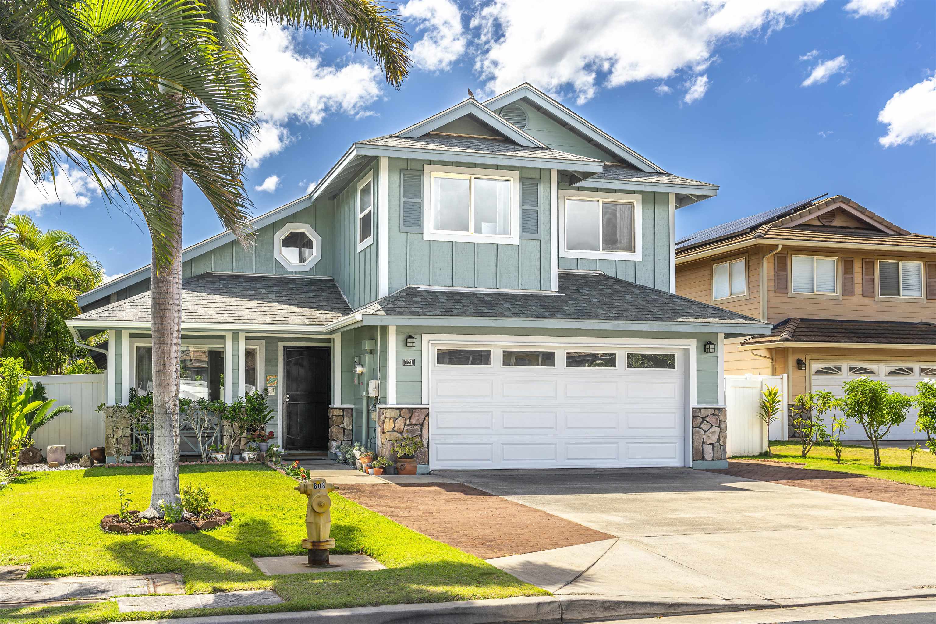 121 Molehulehu Loop Kahului, HI 96732 - Photo 3 of 43 a front view of a house with yard and glass windows