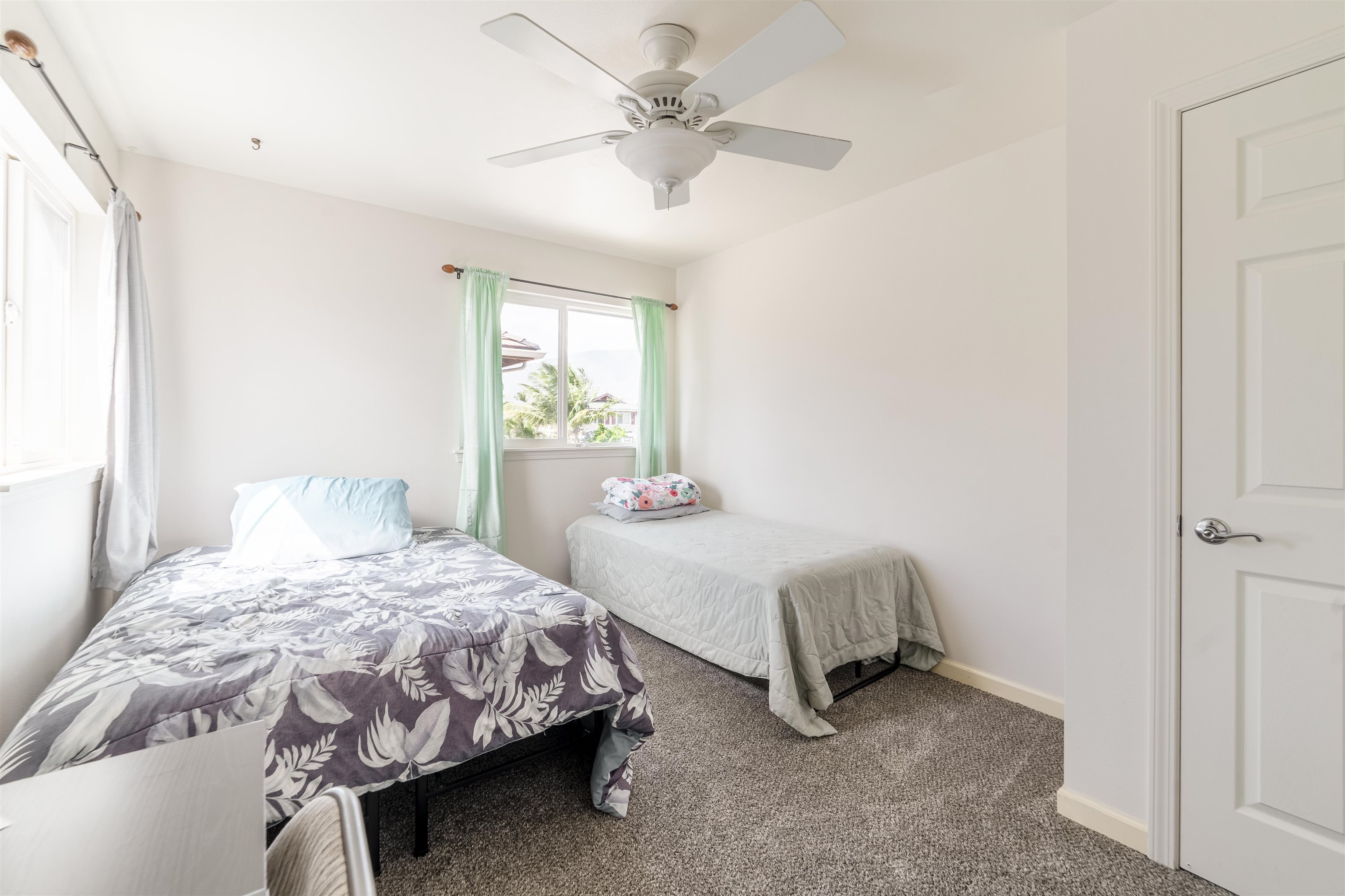 121 Molehulehu Loop Kahului, HI 96732 - Photo 31 of 43 a bedroom with a bed and a table