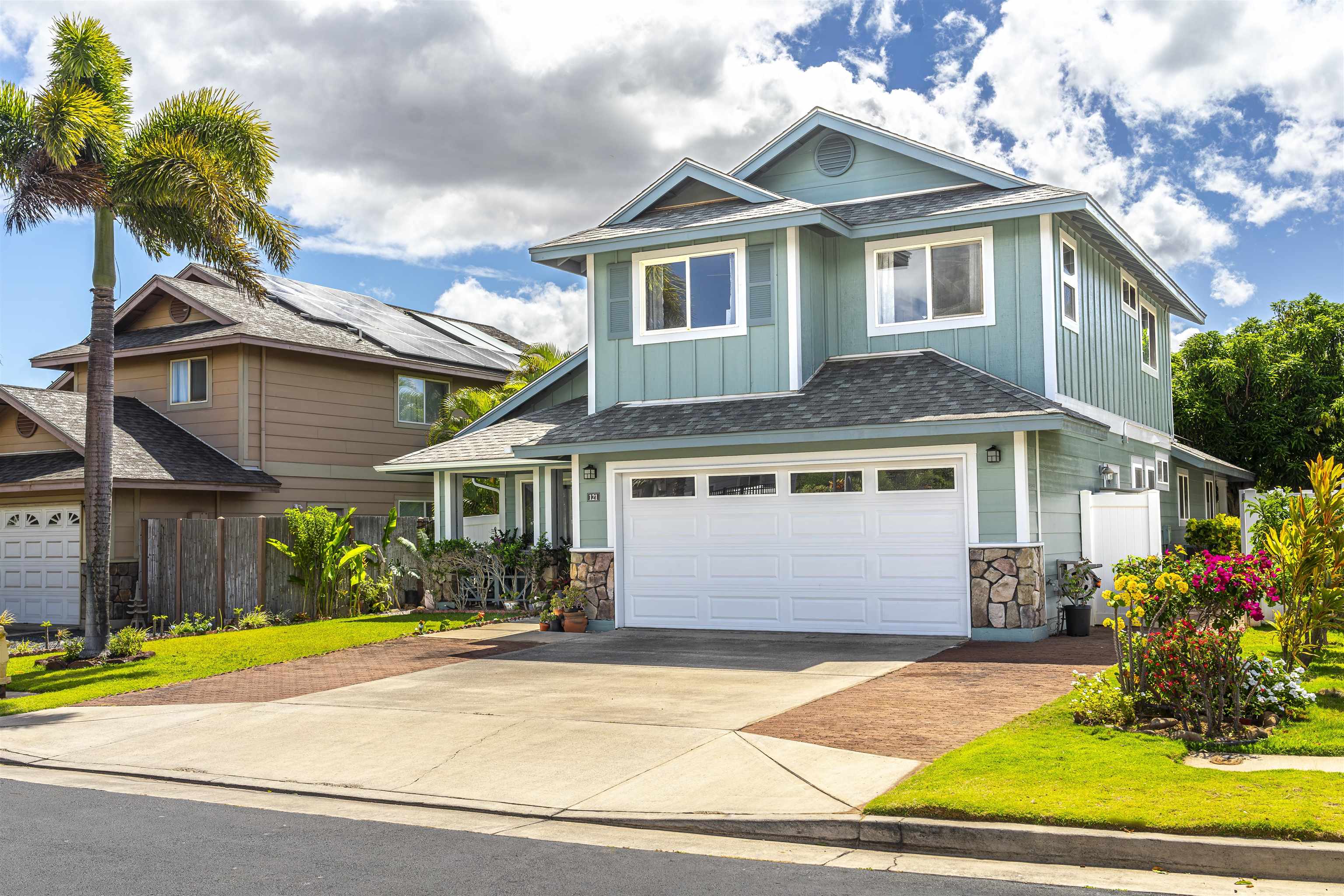 121 Molehulehu Loop Kahului, HI 96732 - Photo 4 of 43 a front view of a house with a yard and garage