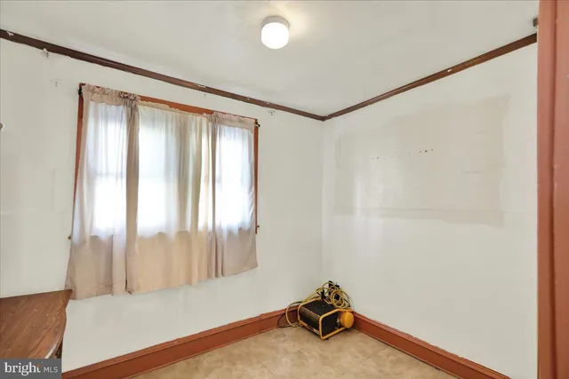 a view of a kitchen with a sink refrigerator and wooden floor
