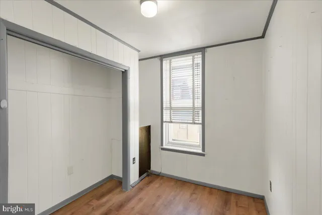 a bathroom with a toilet a sink and a window