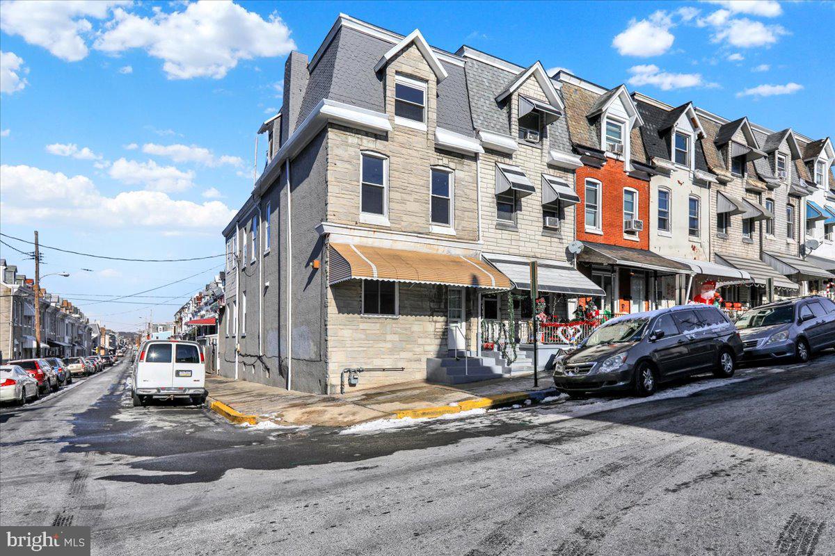 1129 East Greenwich Street Reading, PA 19604 - Photo 2 of 33 a front view of a building with street