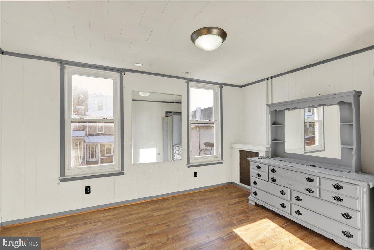 1129 East Greenwich Street Reading, PA 19604 - Photo 25 of 33 a view of an empty room with wooden floor and a window