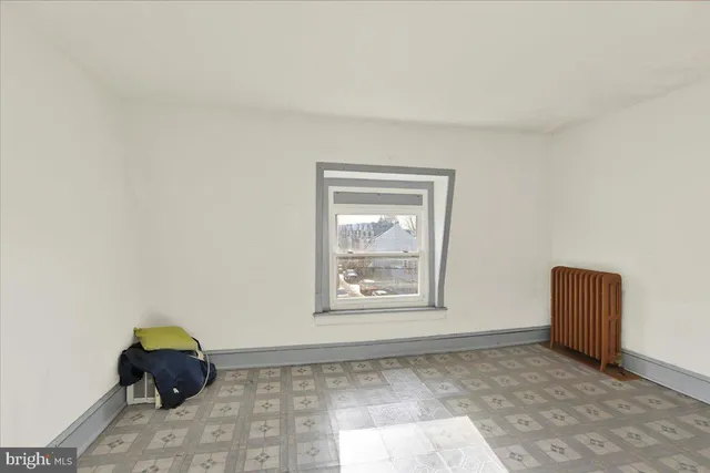 a view of a house with a door and wooden walls