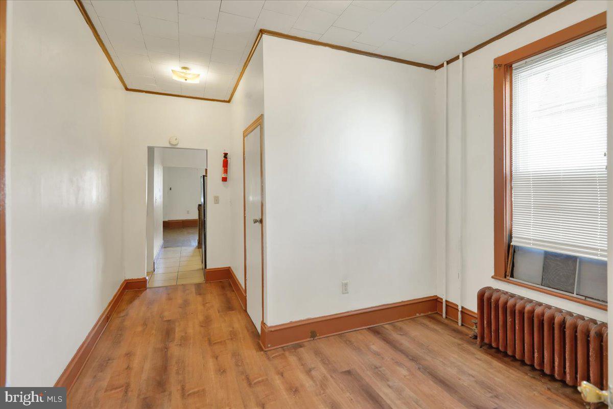 1129 East Greenwich Street Reading, PA 19604 - Photo 9 of 33 a view of a room with wooden floor and a window