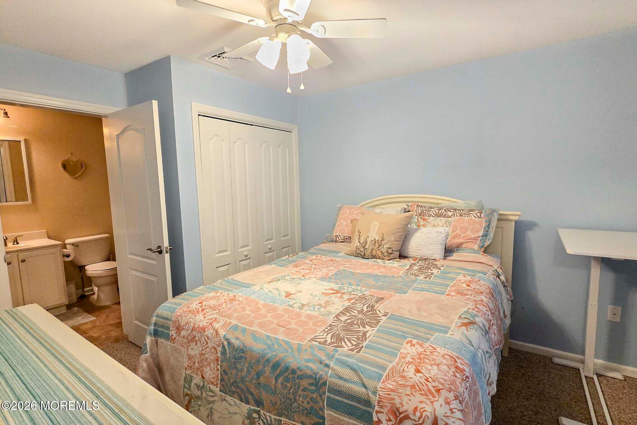 111 President Avenue Lavallette, NJ 08735 - Photo 15 of 54 a bedroom with a bed and wooden floor