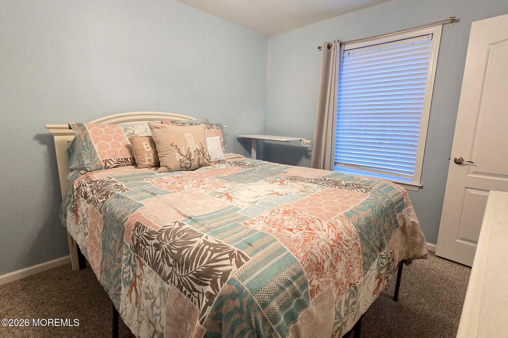 111 President Avenue Lavallette, NJ 08735 - Photo 16 of 54 a bedroom with a bed and a window