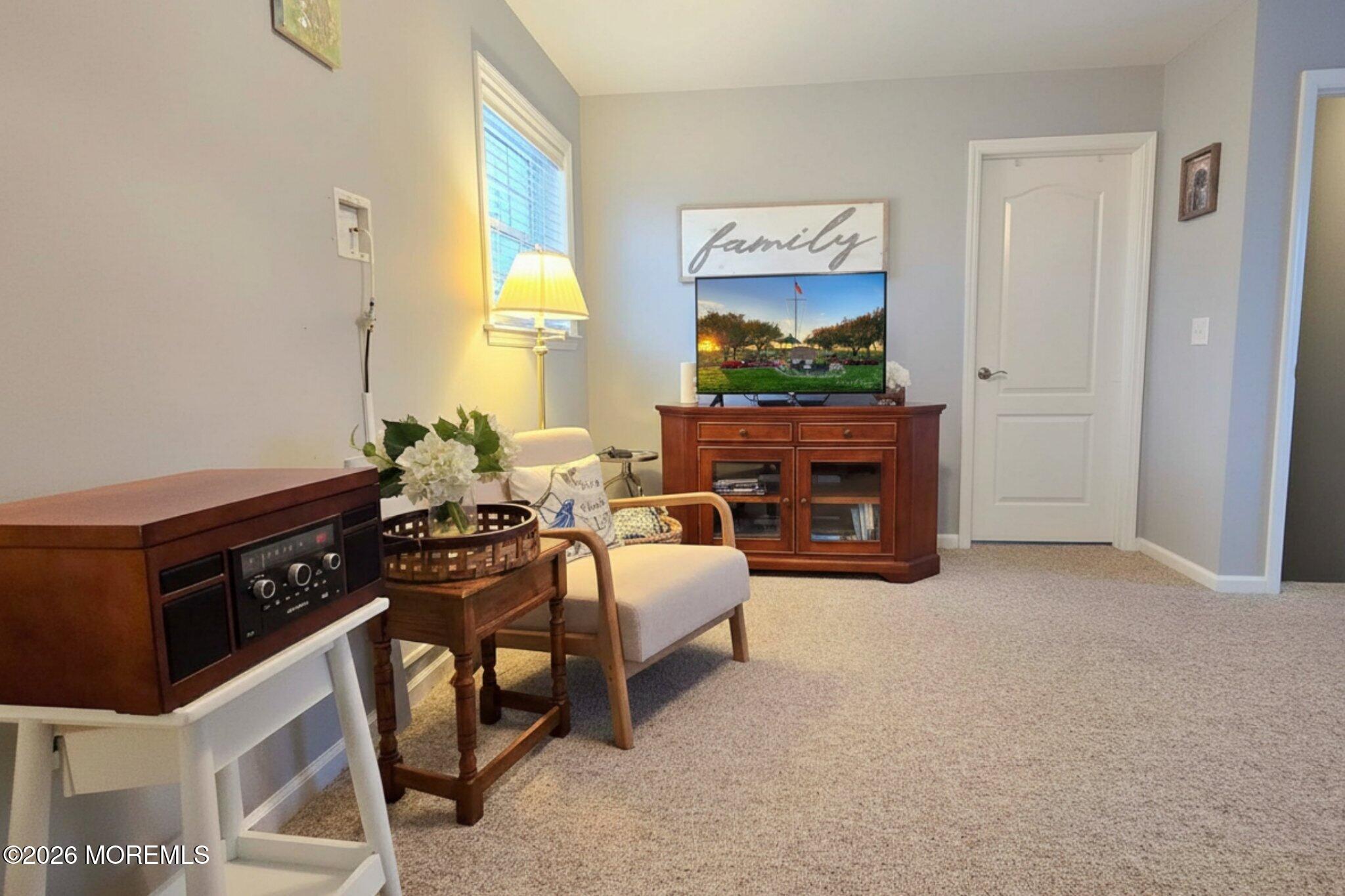 111 President Avenue Lavallette, NJ 08735 - Photo 21 of 54 a living room with furniture a fireplace and a window