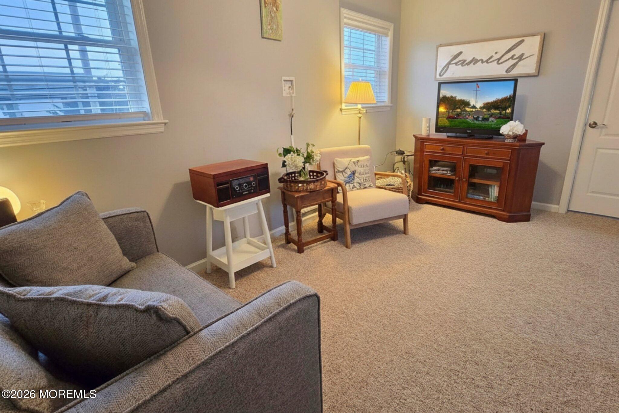 111 President Avenue Lavallette, NJ 08735 - Photo 22 of 54 a living room with furniture and a window