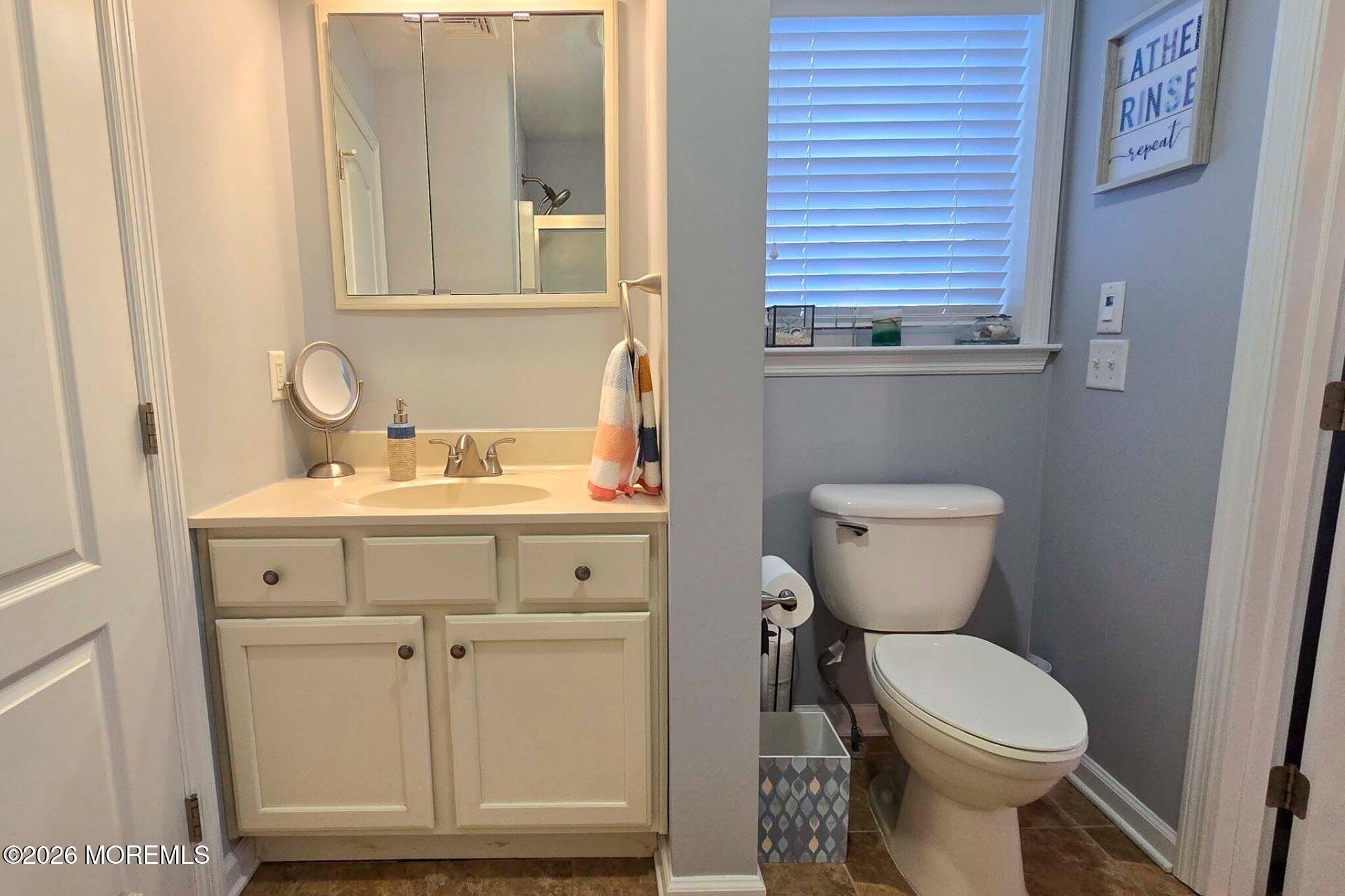 111 President Avenue Lavallette, NJ 08735 - Photo 26 of 54 a bathroom with a toilet sink and mirror