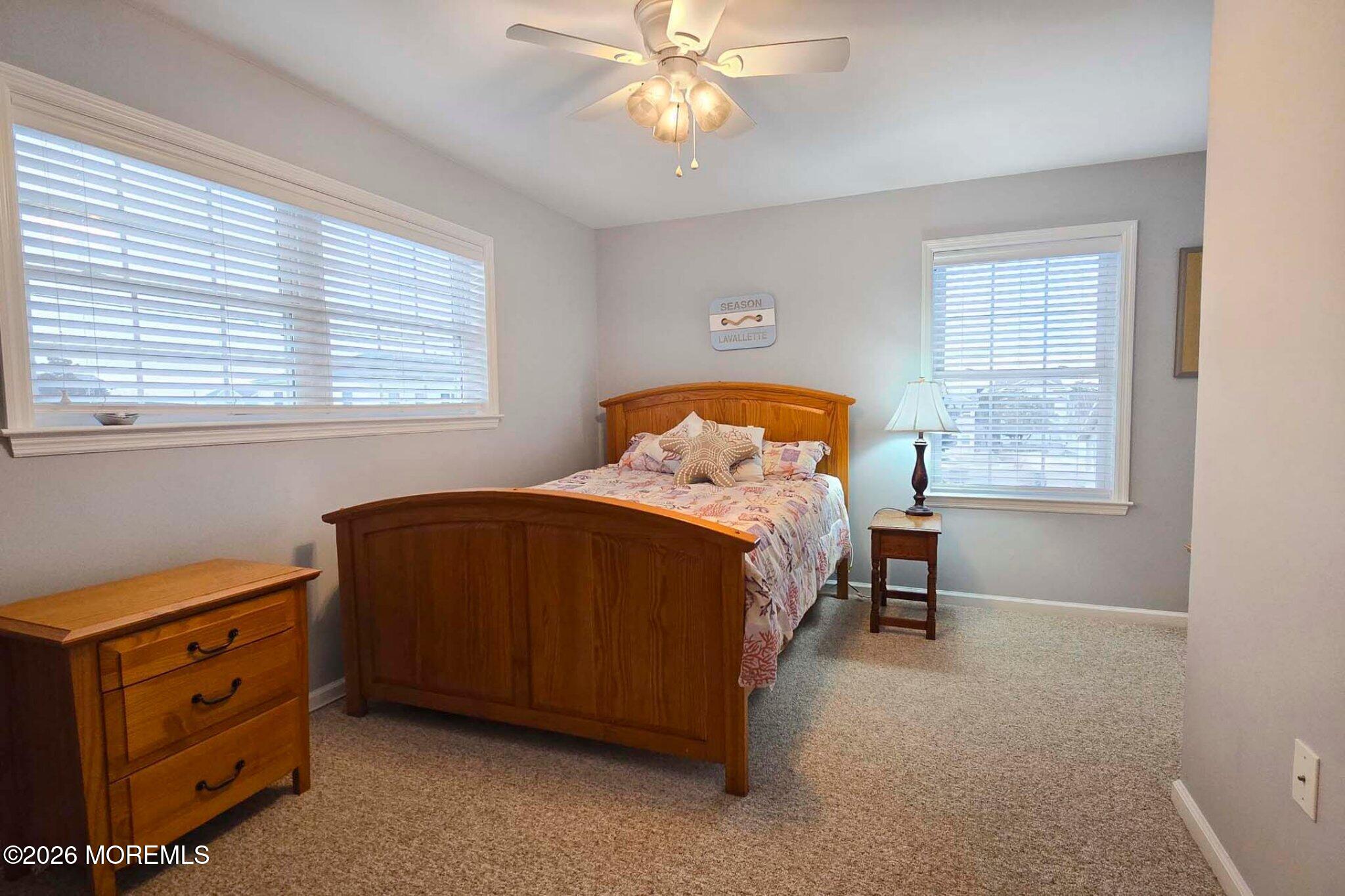 111 President Avenue Lavallette, NJ 08735 - Photo 30 of 54 a bedroom with a bed and a window