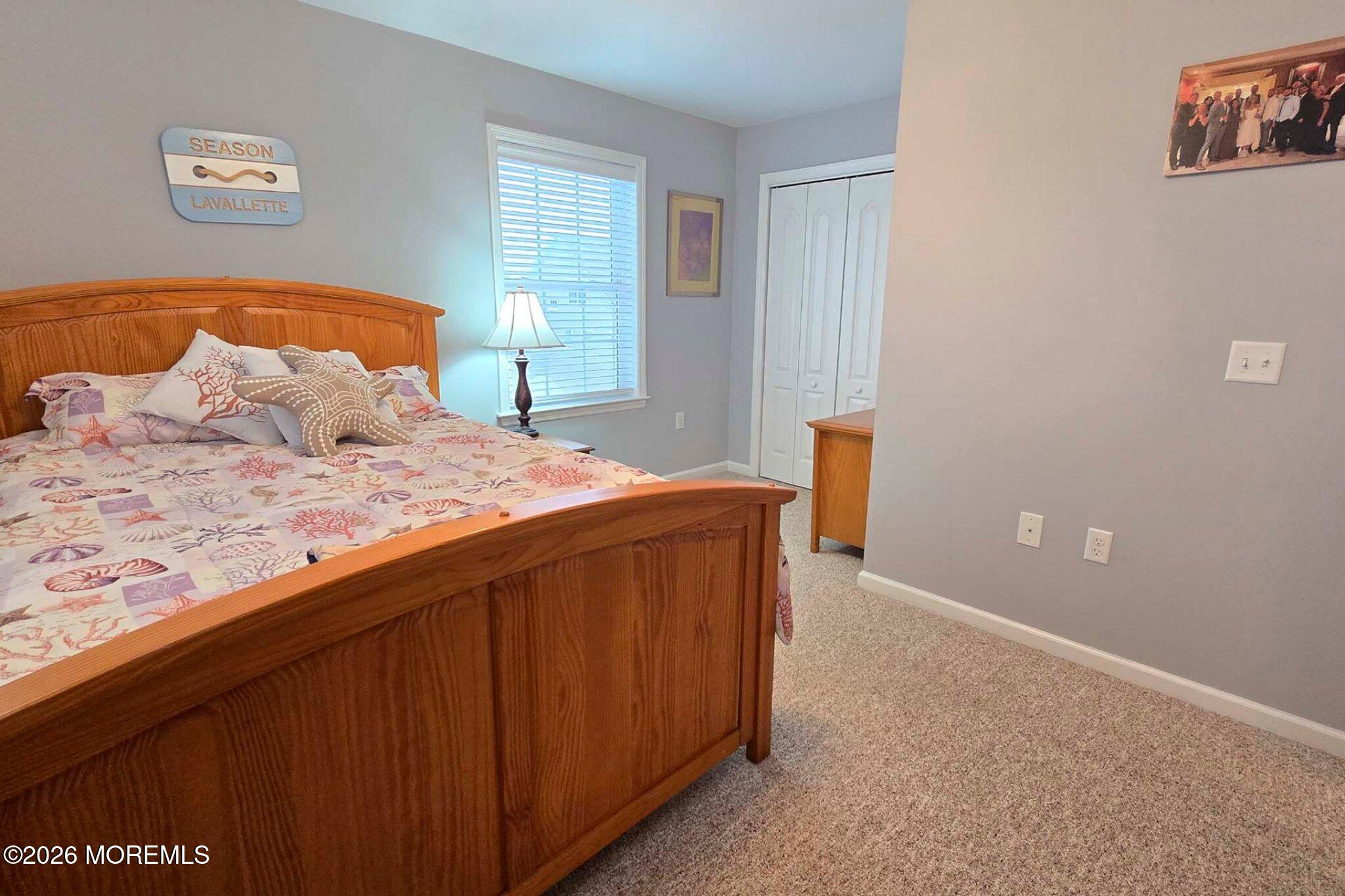 111 President Avenue Lavallette, NJ 08735 - Photo 31 of 54 a bedroom with a bed and a window
