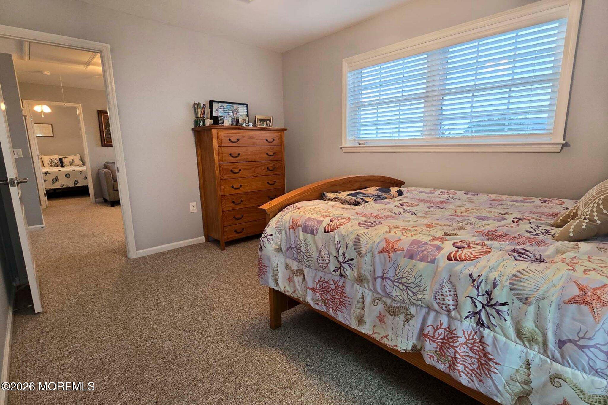 111 President Avenue Lavallette, NJ 08735 - Photo 32 of 54 a bedroom with a bed and a cabinets