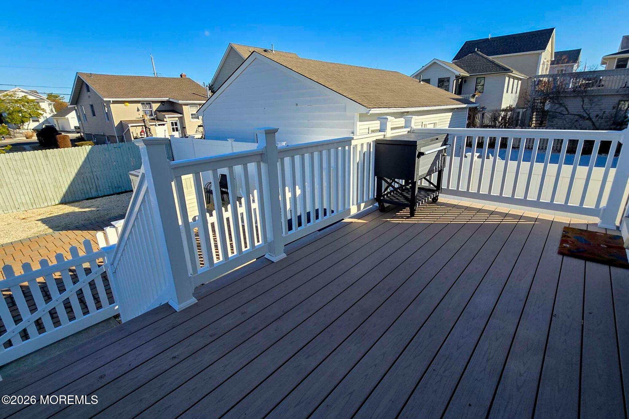 111 President Avenue Lavallette, NJ 08735 - Photo 41 of 54 a view of a roof deck with wooden floor and fence