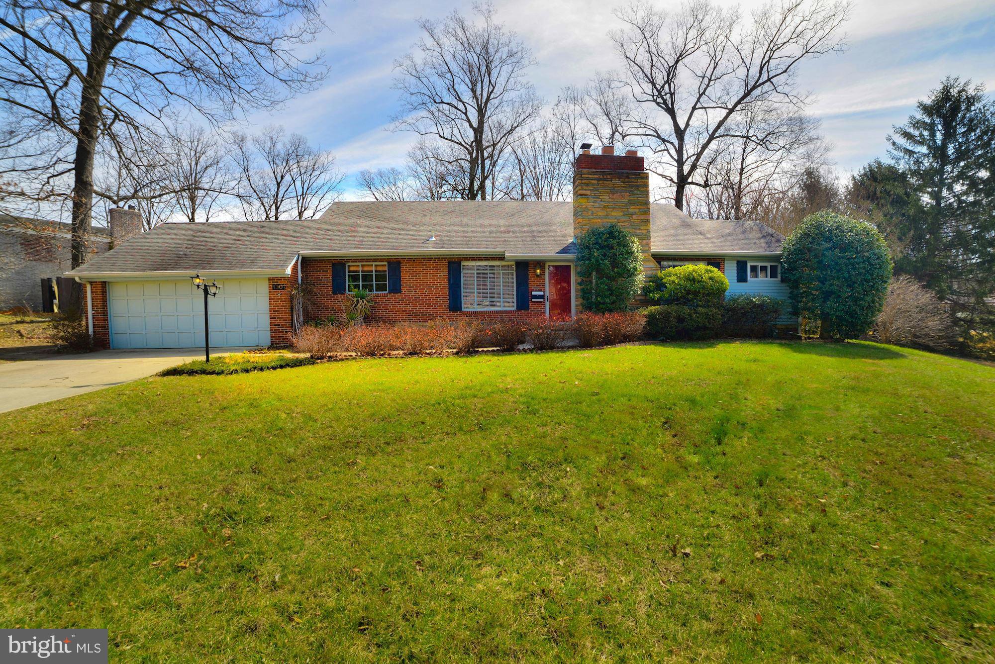 1301 Chalmers Road Silver Spring, MD 20903 - Photo 1 of 28 a front view of house with yard and green space