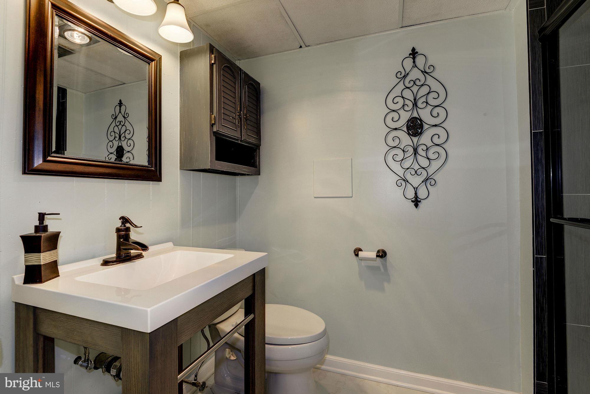 1301 Chalmers Road Silver Spring, MD 20903 - Photo 12 of 28 a bathroom with a sink and a toilet