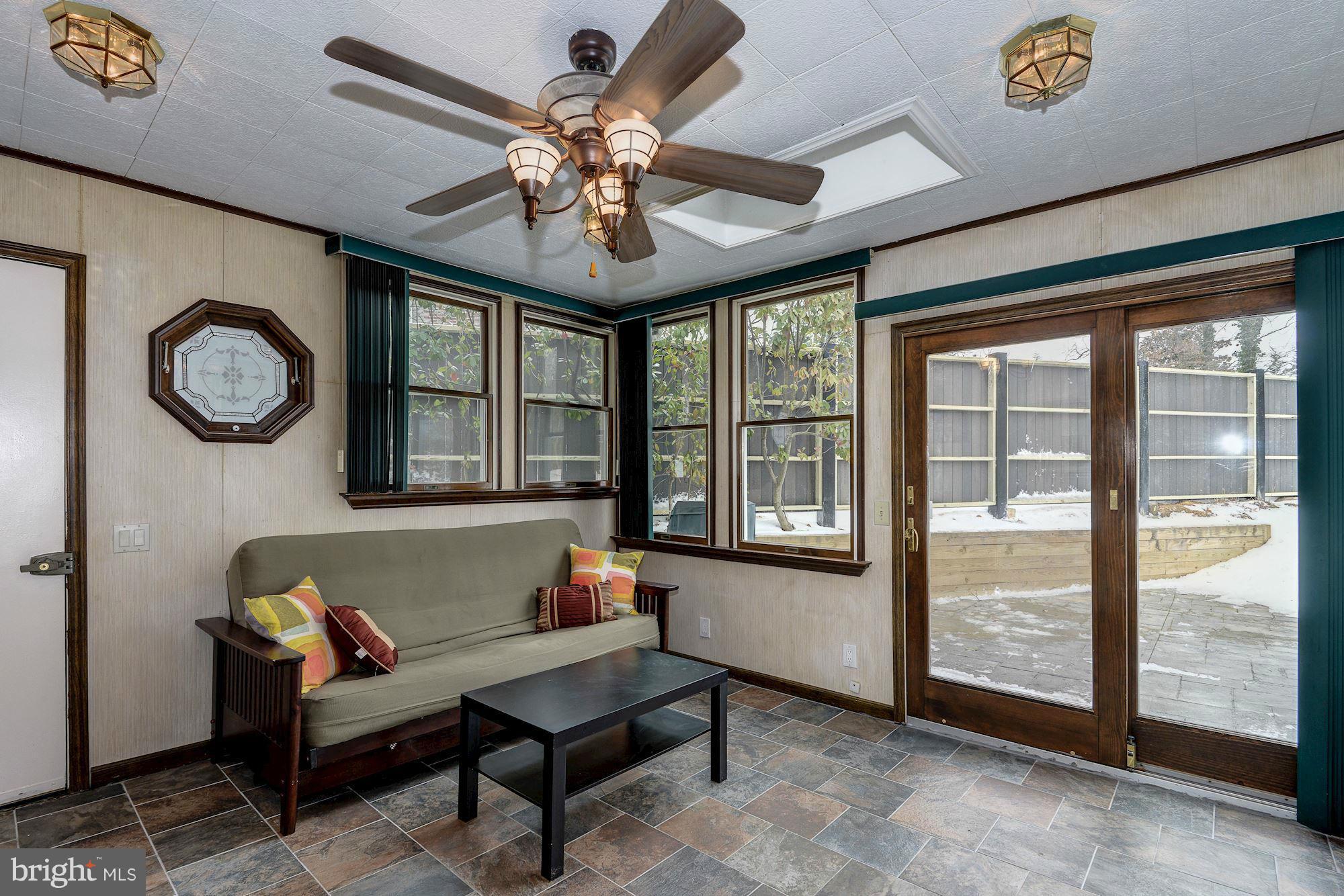 1301 Chalmers Road Silver Spring, MD 20903 - Photo 13 of 28 a living room with furniture and a large window