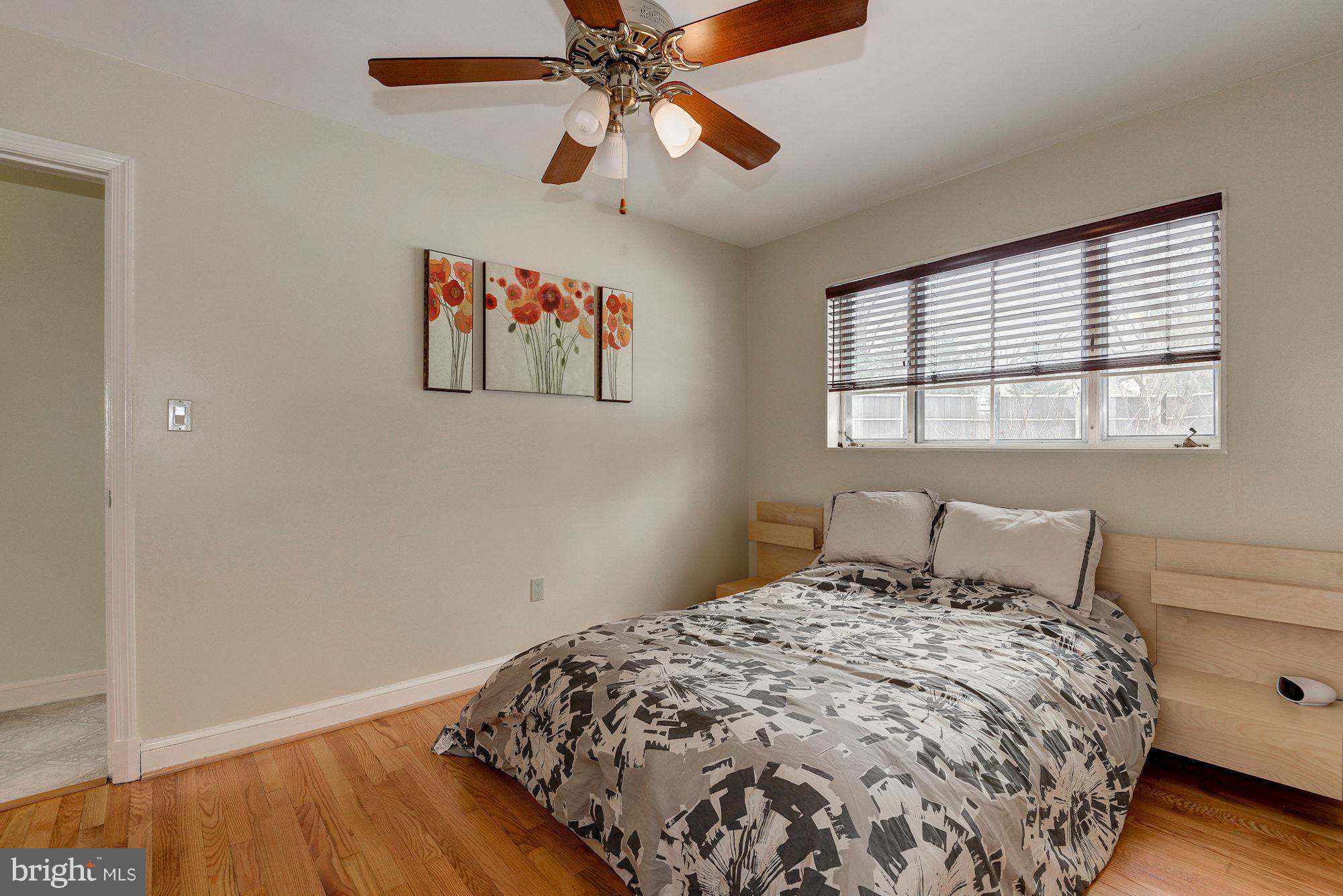 1301 Chalmers Road Silver Spring, MD 20903 - Photo 18 of 28 a bedroom with a bed and a window