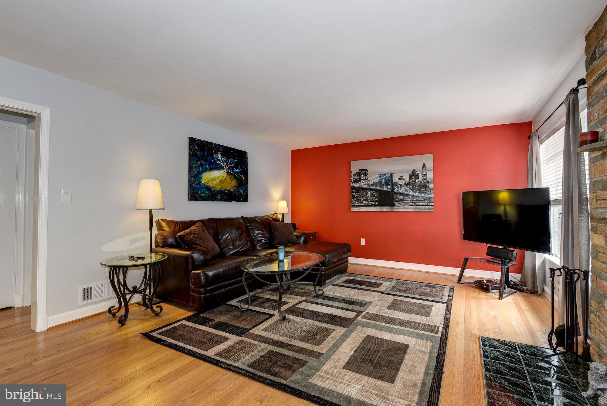 1301 Chalmers Road Silver Spring, MD 20903 - Photo 8 of 28 a living room with furniture and a flat screen tv