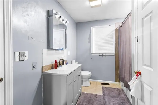 a bedroom with a bed and a closet