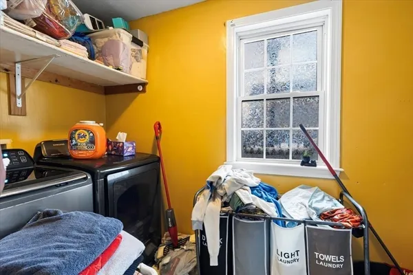 a kitchen with a sink cabinets and wooden floor
