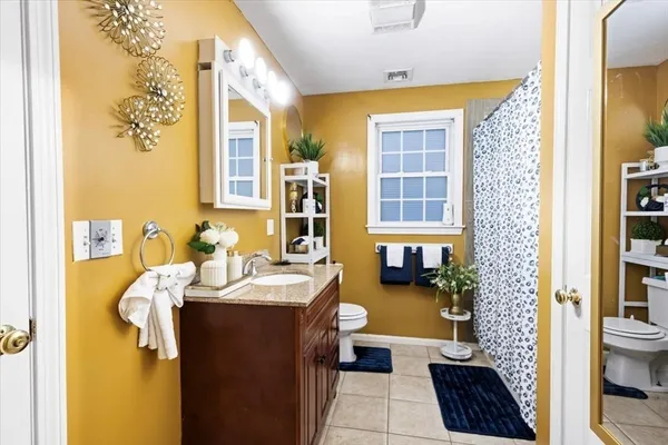 a bedroom with a bed and a table