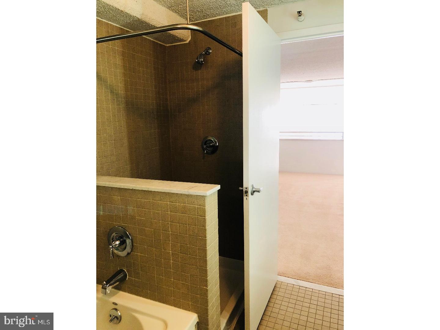 2300 Walnut Street, Unit 1B423 Philadelphia, PA 19103 - Photo 2 of 11 a bathroom with a shower and a sink