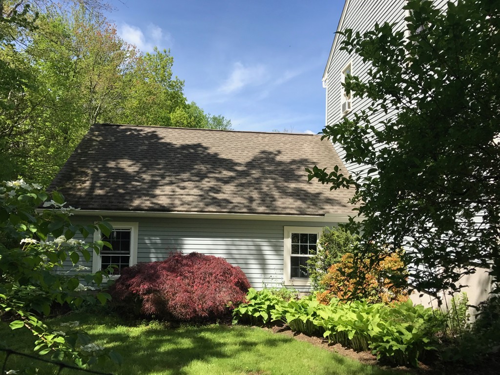 95 George Hill Road Grafton, MA 01519 - Photo 3 of 24 front view of a house with a garden