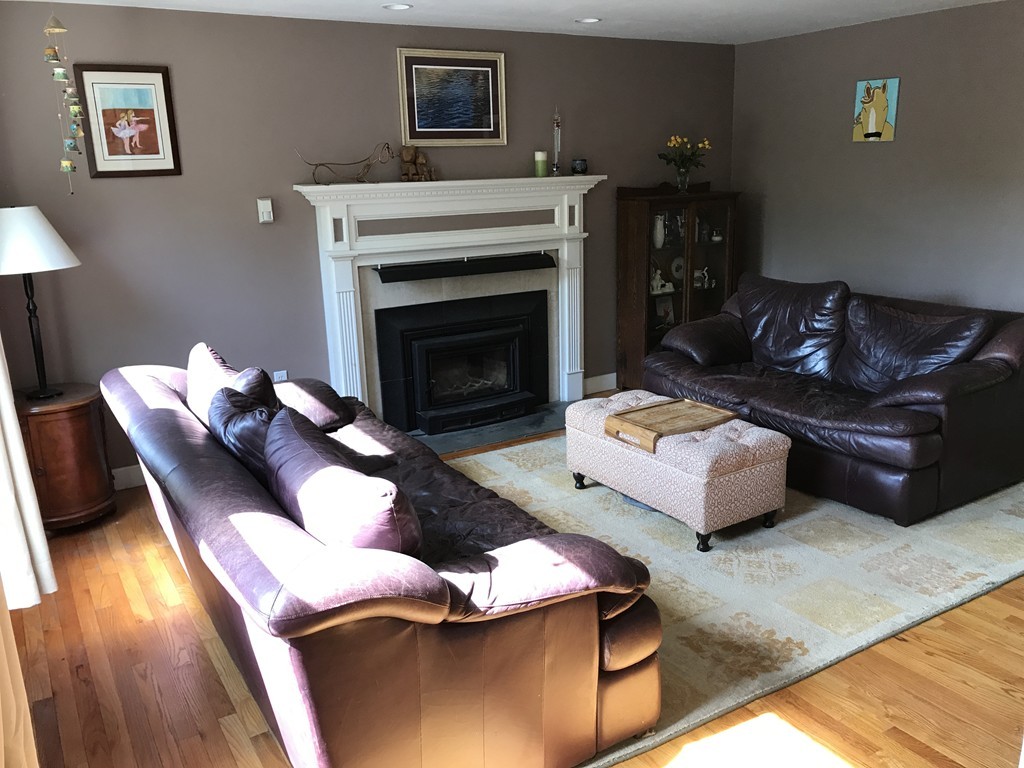 95 George Hill Road Grafton, MA 01519 - Photo 6 of 24 a living room with furniture and a fireplace