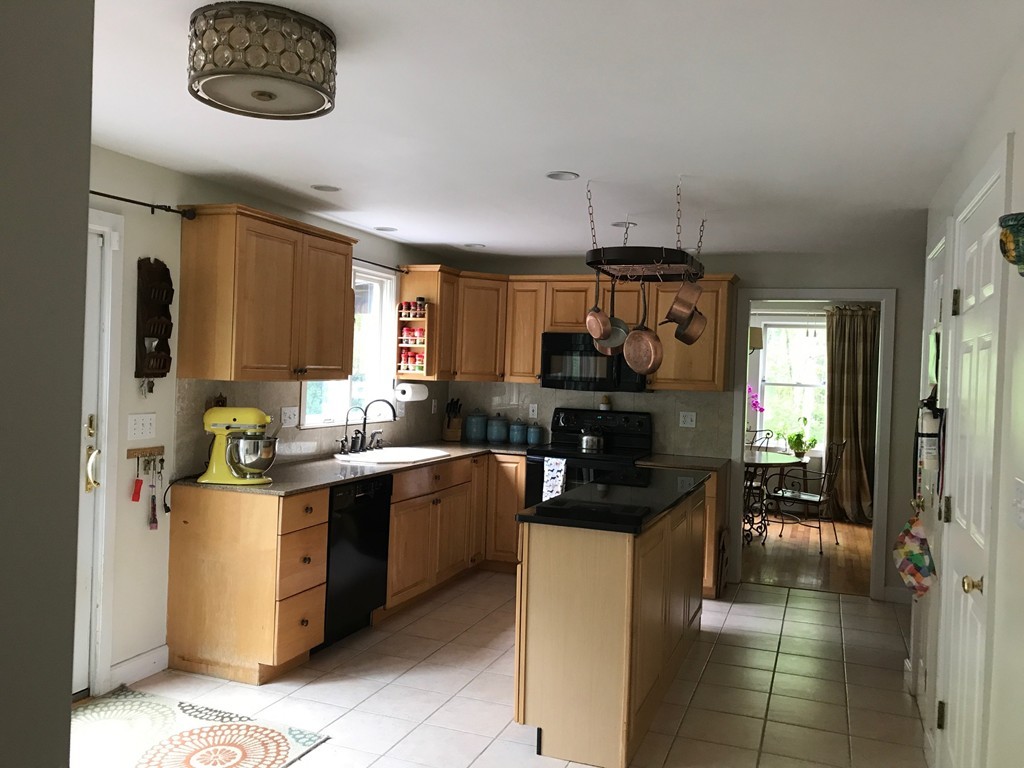 95 George Hill Road Grafton, MA 01519 - Photo 8 of 24 a kitchen with stainless steel appliances granite countertop a stove and a sink