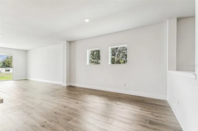 a large kitchen with stainless steel appliances kitchen island a large counter top and a sink