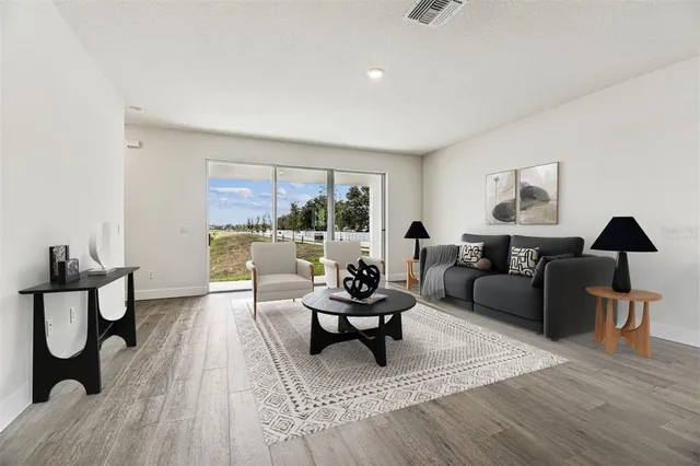a view of an empty room and wooden floor