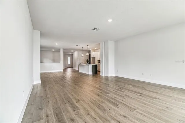 a room with a bed and a potted plant