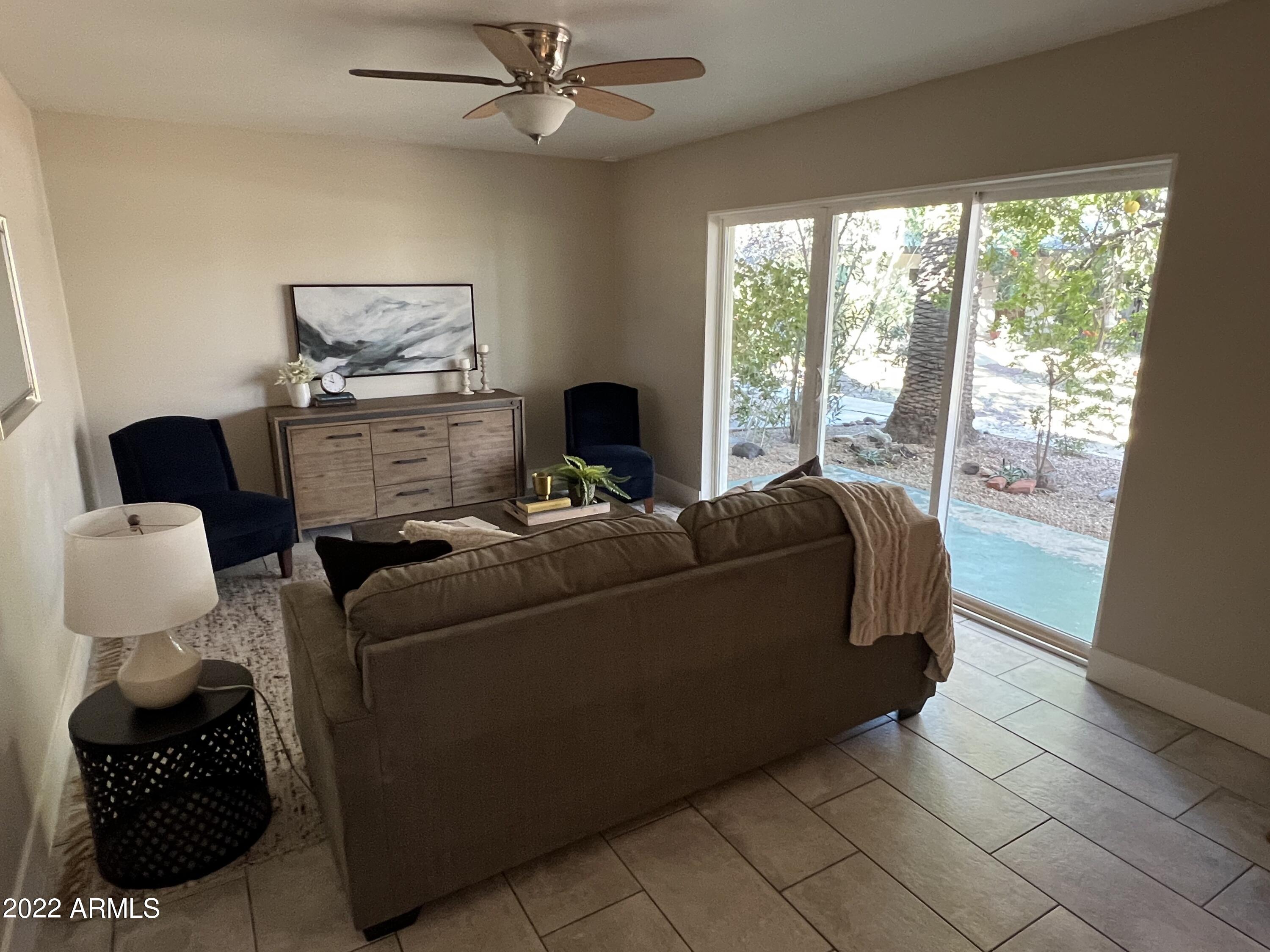 1250 East Bethany Home Road, Unit 17 Phoenix, AZ 85014 - Photo 8 of 25 a living room with furniture and a window