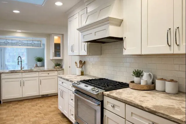 a kitchen with cabinets a sink and appliances