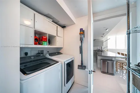 a kitchen with stainless steel appliances granite countertop a refrigerator and a stove