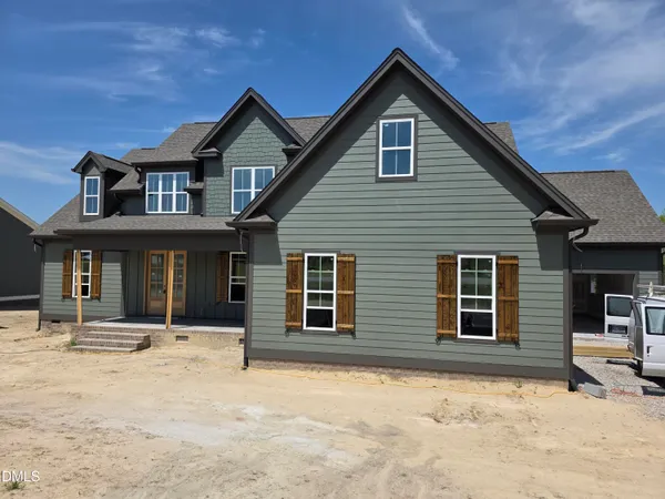 a front view of a house with a yard outdoor seating