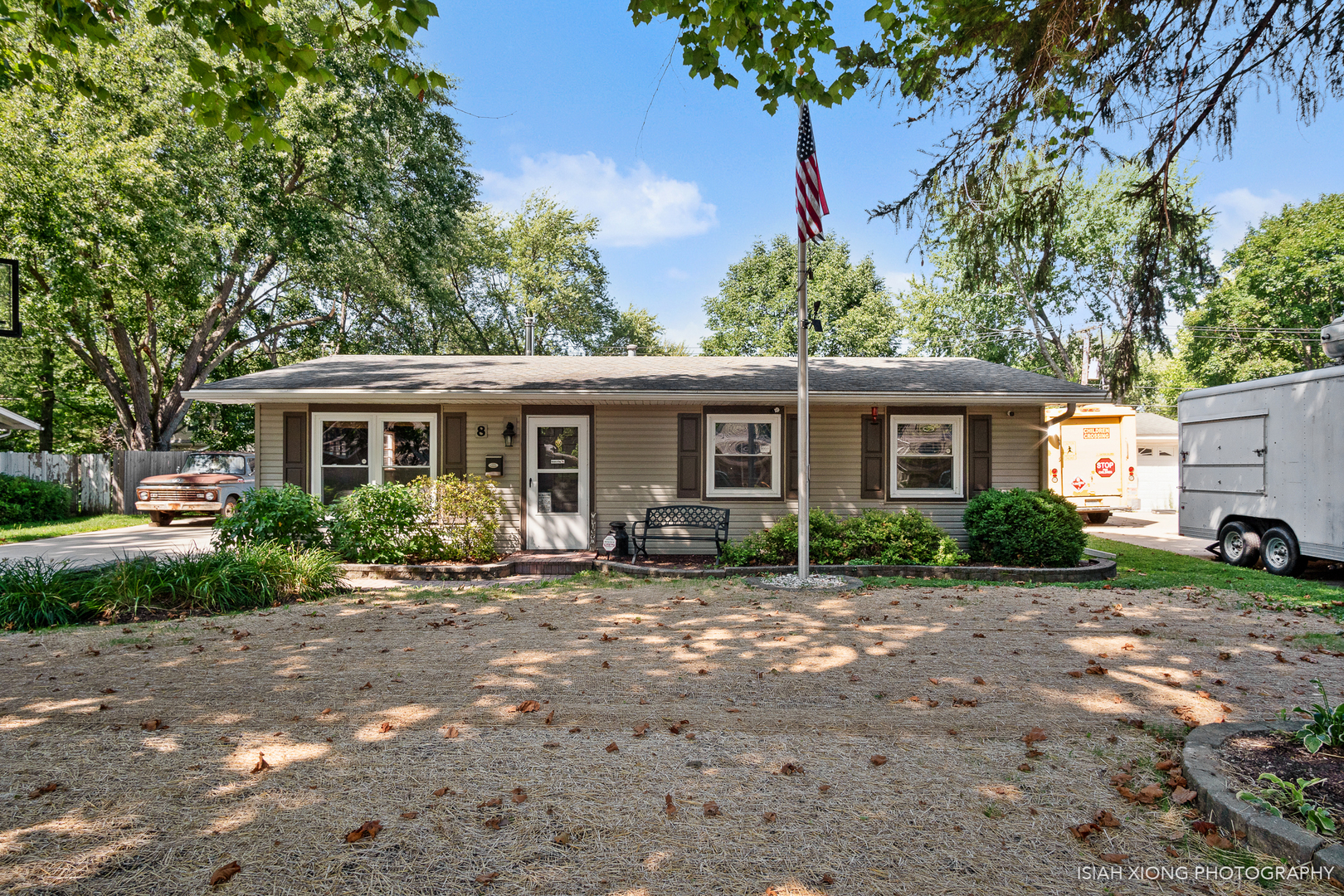8 Hampton Road Montgomery, IL 60538 - Photo 1 of 26 a front view of a house with a garden and trees