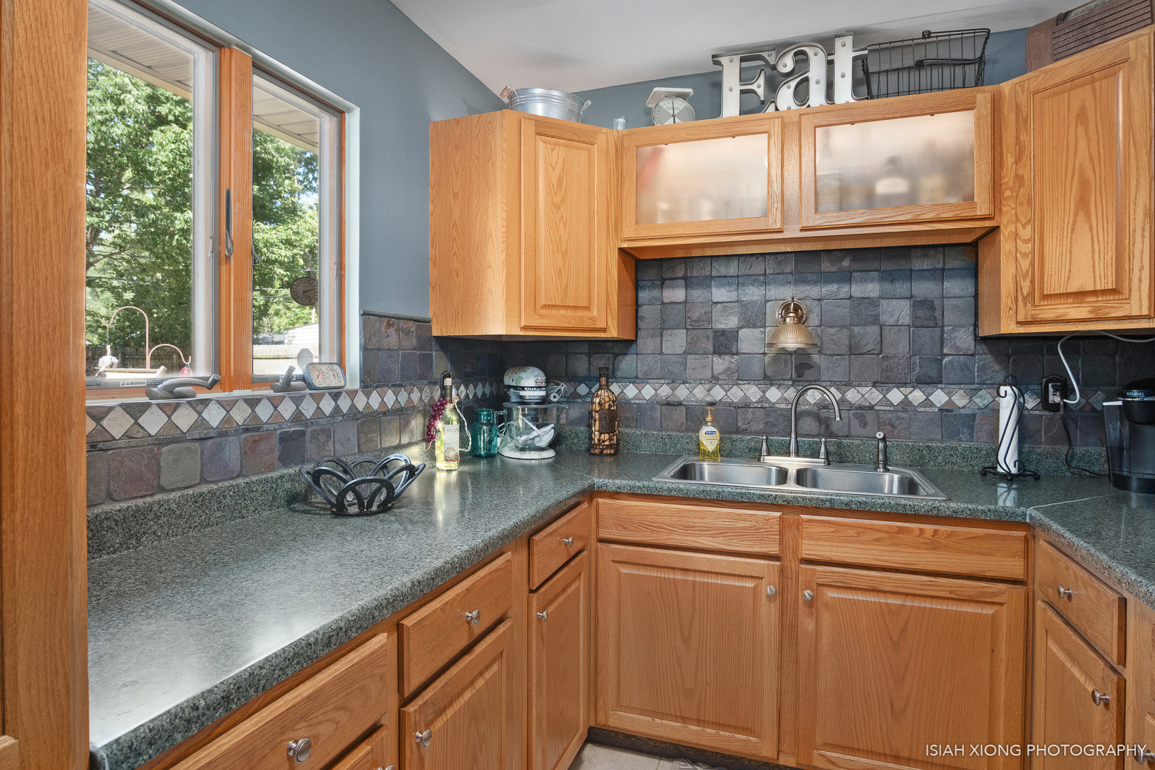 8 Hampton Road Montgomery, IL 60538 - Photo 5 of 26 a kitchen with stainless steel appliances granite countertop white cabinets a window and a sink