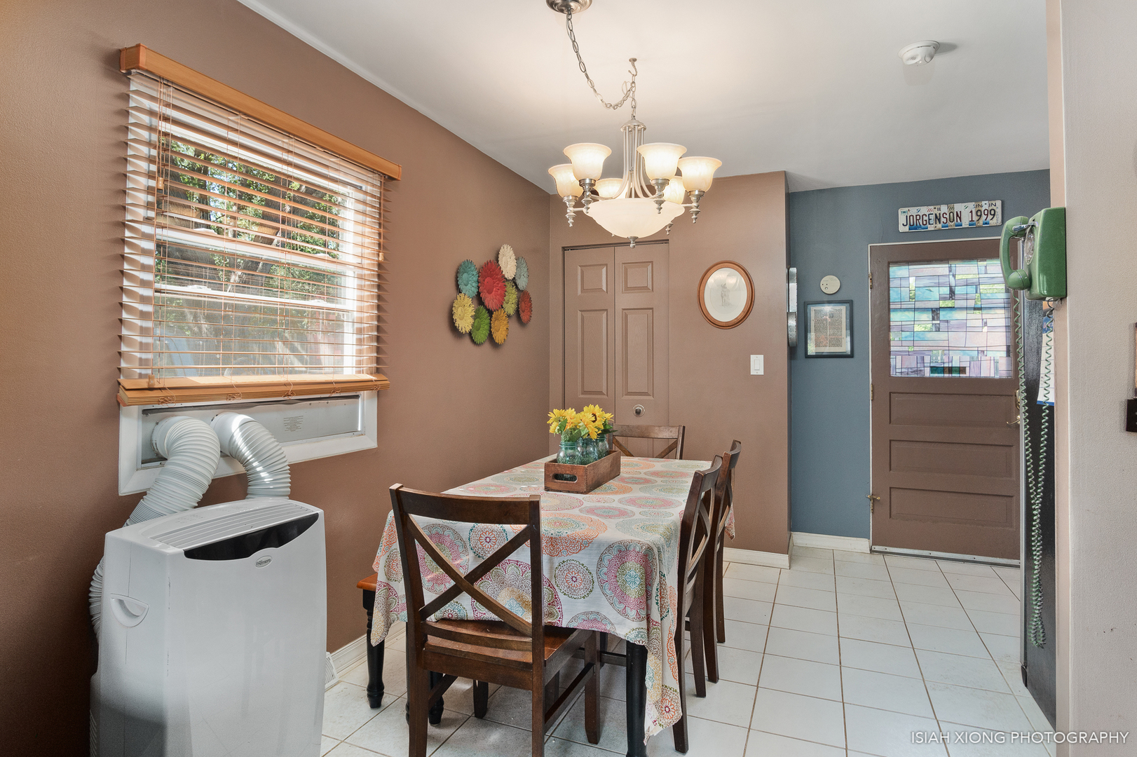 8 Hampton Road Montgomery, IL 60538 - Photo 7 of 26 a view of a dining room with furniture a chandelier and a window