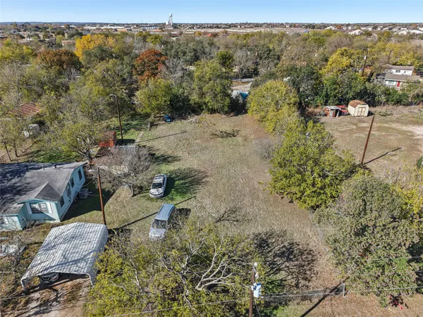 a view of a mountain with a yard