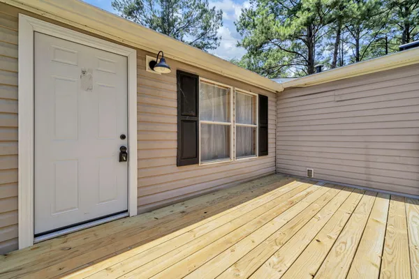 a view of a two chairs in the balcony