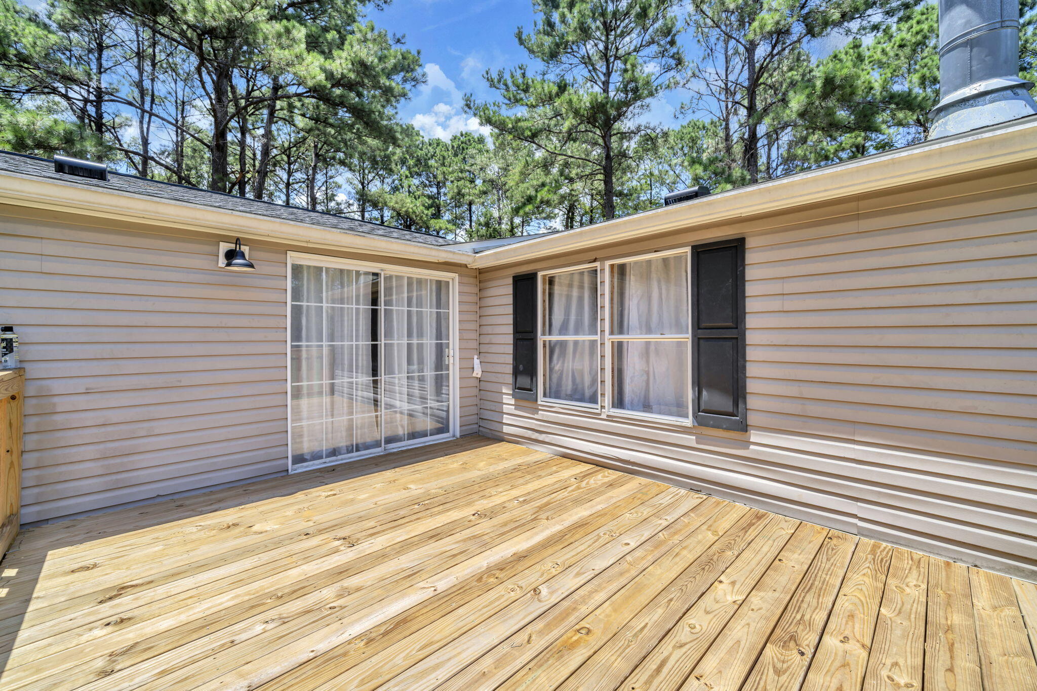 5216 Galiver Cutoff Baker, FL 32531 - Photo 14 of 51 a view of a backyard with a garden