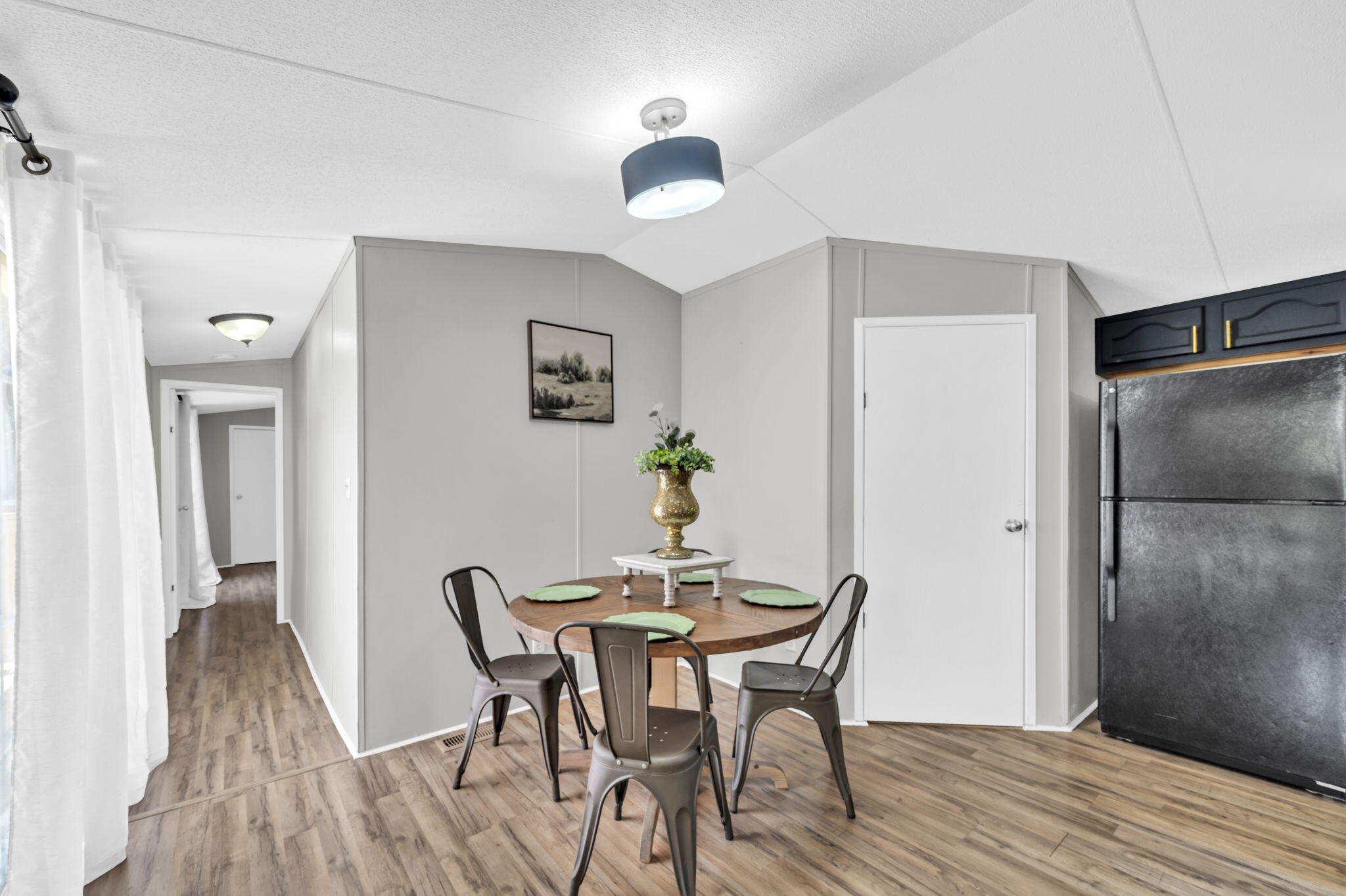 5216 Galiver Cutoff Baker, FL 32531 - Photo 23 of 51 a view of a dining room with furniture and wooden floor
